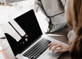 A freelancer working on a laptop at a desk